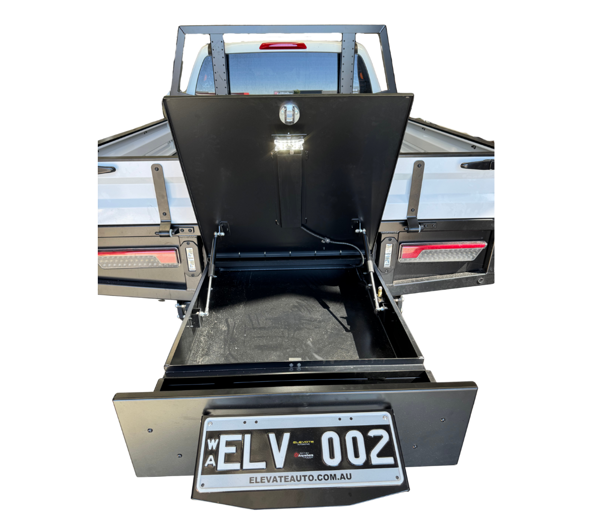 Open truck bed with black toolbox and 'ELV 002' license plate on a white background