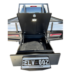 Open truck bed with black toolbox and 'ELV 002' license plate on a white background