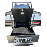 Open truck bed with black toolbox and 'ELV 002' license plate on a white background