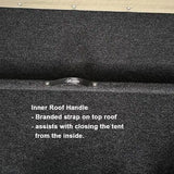 Close-up of a black inner roof handle on a tent with text description.