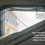 Window of a tent with text describing features, showing a building outside.