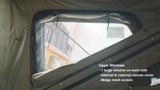 Window of a tent with text describing features, showing a building outside.