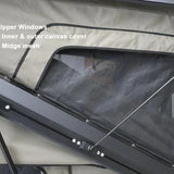 Rooftop tent with upper windows and mesh cover, showing inner and outer canvas cover.