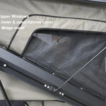 Rooftop tent with upper windows and mesh cover, showing inner and outer canvas cover.