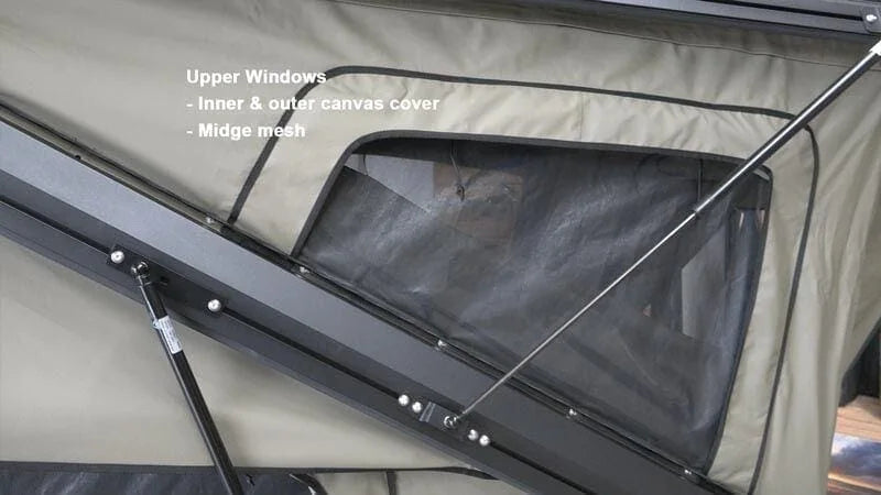 Rooftop tent with upper windows and mesh cover, showing inner and outer canvas cover.