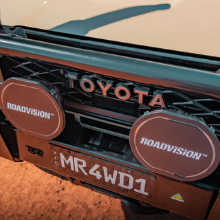 Close-up of a Toyota vehicle with Roadvision lights and a license plate.