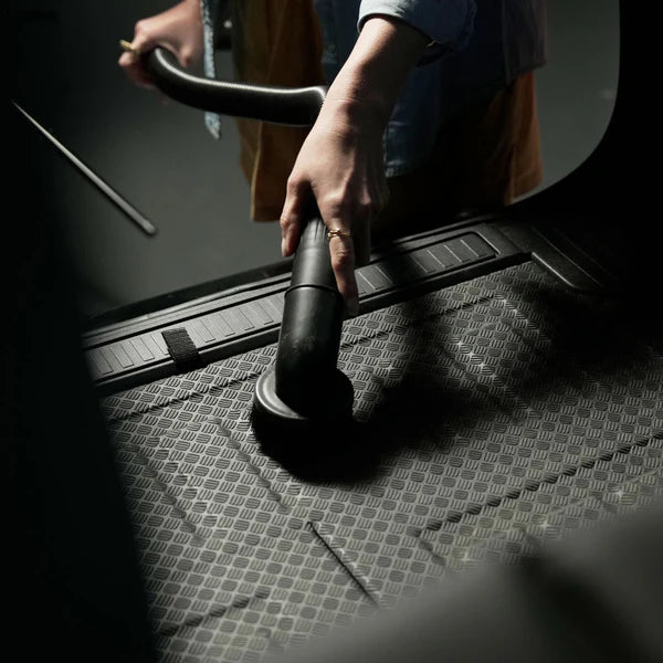 Person using Blahst K21 Wall-Mounted Vacuum