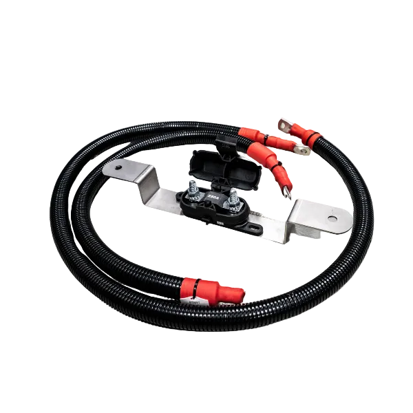 An upgraded wiring kit for 70 series Landcruiser with red and black cables, lugs, and brackets.