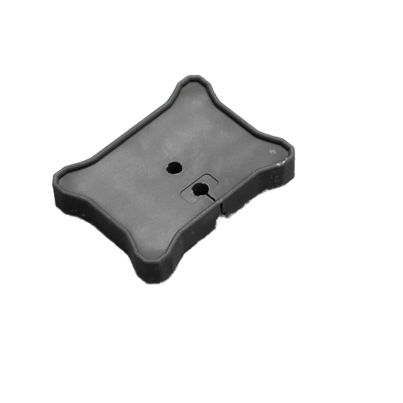 Flat mount seen from above with its hardware, the mounting hole and cable slot visible in the top face beside the nut, washers, blanking plug and two screws