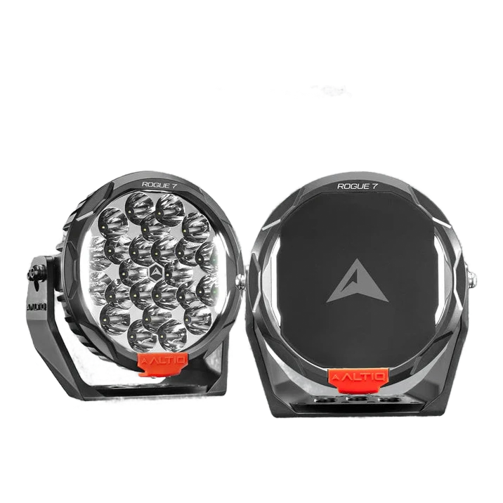 A pair of ALTIQ Rogue 7 driving lights side by side, one showing the reflector face with its cluster of LEDs and the ROGUE 7 marking on the bezel, the other fitted with a black cover carrying the ALTIQ arrow, both with red ALTIQ trim tabs at the base