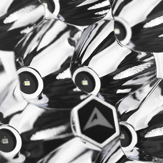 Macro of the Rogue reflector, individual LEDs seated in polished chrome cups around a hexagonal centre badge carrying the ALTIQ arrow