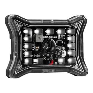 ALTIQ Spectrum Pro rock light face on, the clear lens over the LED board with the numbered LED positions, the inductor marked 560 and the 47 microfarad 35 volt capacitor visible