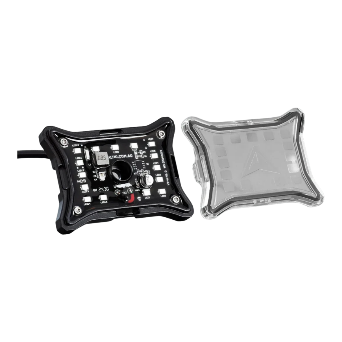 The rock light shown in two parts, the LED board in its black frame with the lead attached beside the clear lens cover that clips over it