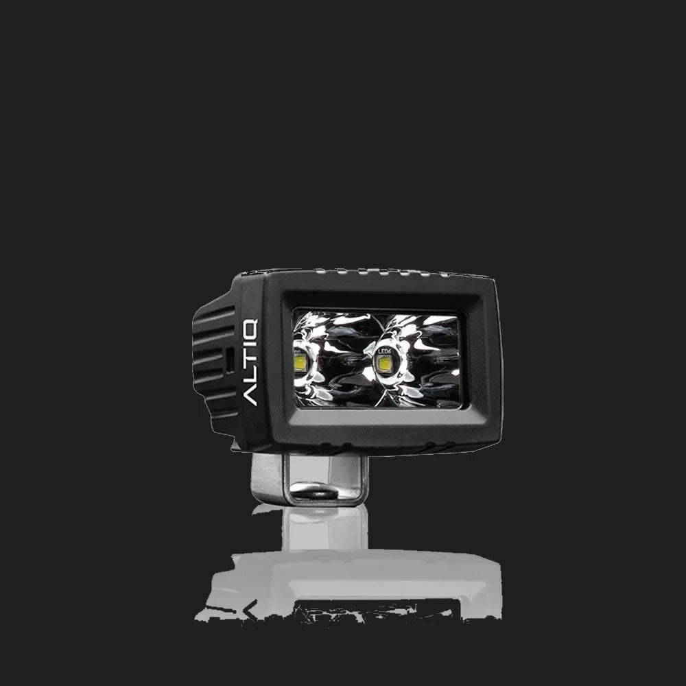 ALTIQ CX2 spot work light face on, a rectangular reflector holding two deep spot optics with a single LED in each, the ALTIQ name on the left cheek