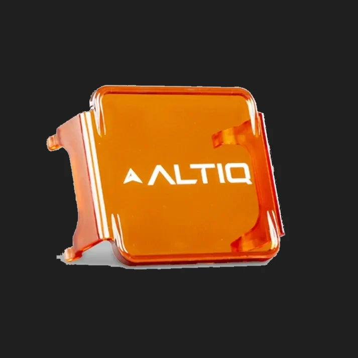 Amber DX4 lens cover at a three-quarter angle, the ALTIQ name across the face and the side skirts that wrap the light housing