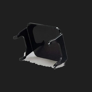 Black DX4 blackout cover seen from behind and above, the gloss panel with its side skirts and the four moulded retaining clips