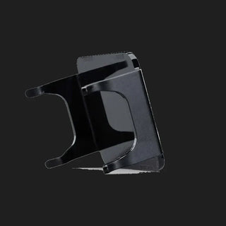 Black DX4 blackout cover seen edge on from behind, showing the depth of the skirts and the clips that hook over the light housing