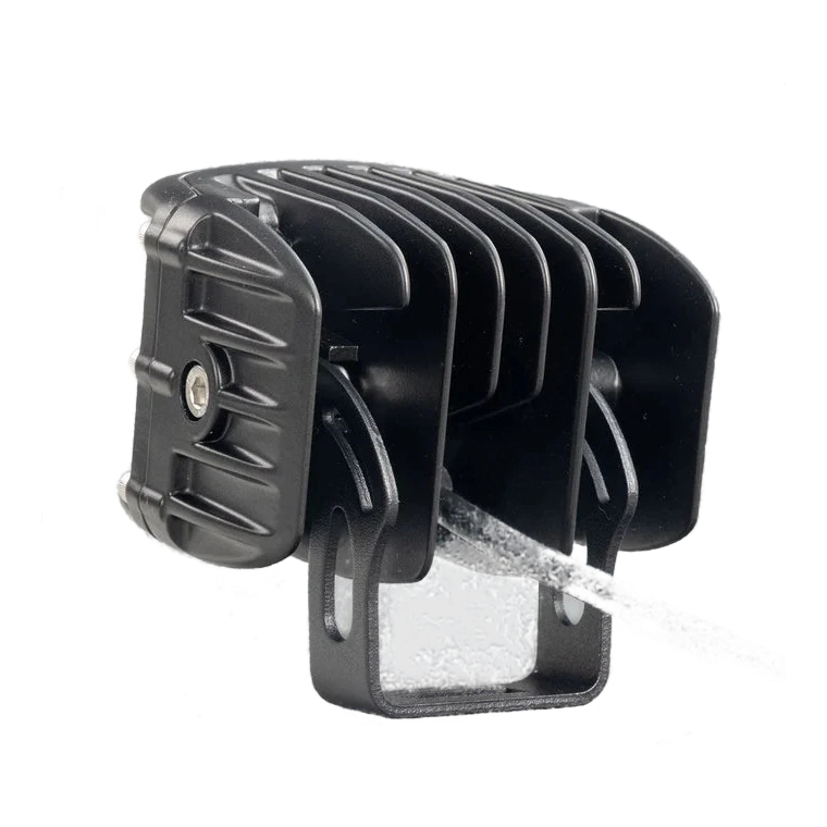 DX4 hybrid work light from behind and to the side, the deeply finned cast heatsink, the black mounting bracket and the lead leaving the rear