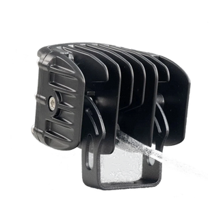 DX4 hybrid work light from behind and to the side, the deeply finned cast heatsink, the black mounting bracket and the lead leaving the rear