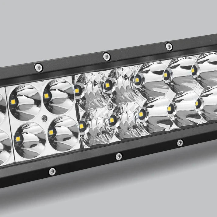 Close-up of the double row bar at an angle, showing where the round spot optics meet the rectangular flood block and the screws along the bezel