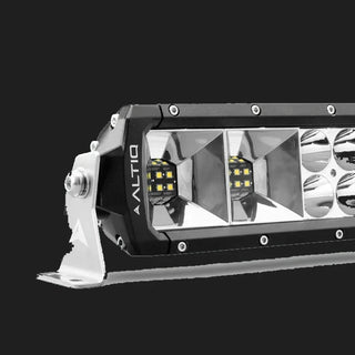 End of the double row hybrid light bar, showing two rectangular flood optics with dense LED blocks at the near end and round spot reflectors beyond, with the ALTIQ name on the end cap and a stainless side bracket