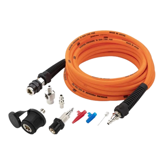 The same ARB pump up kit shown from a lower angle, the coiled orange hose behind the couplings, adaptors, deflators and chuck