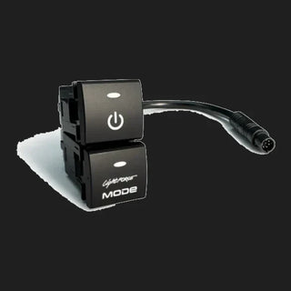 The two-position Lightforce switch assembly at an angle, showing the moulded retaining clips behind each button and the short lead ending in a round multi-pin connector