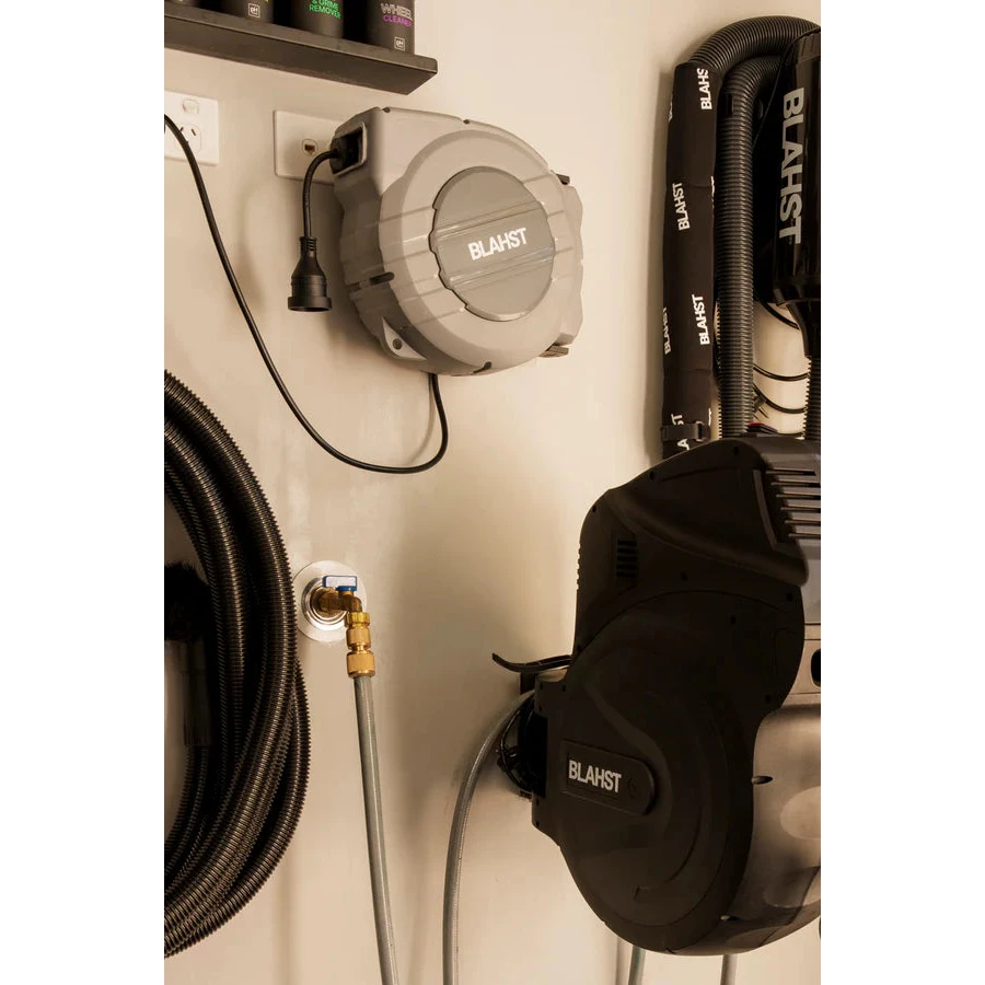 Blahst 10A Retractable Extension Cord reel and tools mounted on a wall