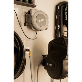 Blahst 10A Retractable Extension Cord reel and tools mounted on a wall