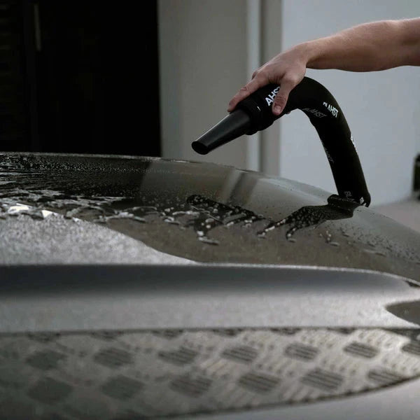 Person using a Air Maxx Dryer to dry a car's bonnet