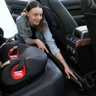 Woman using the Blahst K21 Wall-Mounted Vacuum in a vehicle