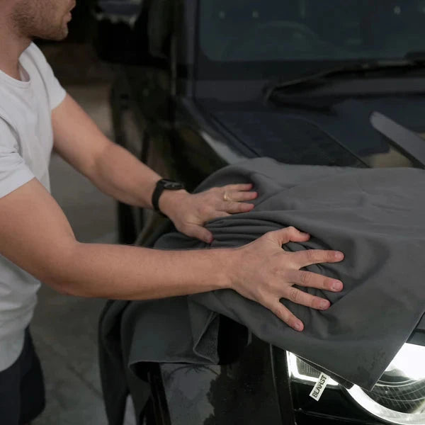 Person using Microfibre Drying Towel on a vehicle