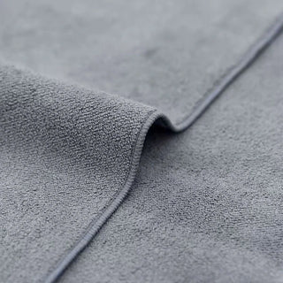 Close-up of gray textured fabric with a focus on texture and color – Blahst Microfibre Drying Towel