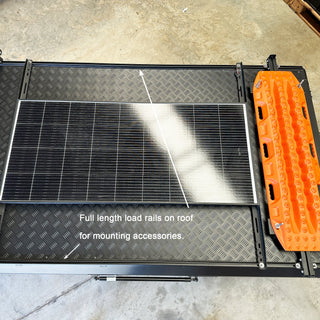 Bush Company AX27 roof load rails carrying a solar panel and recovery boards