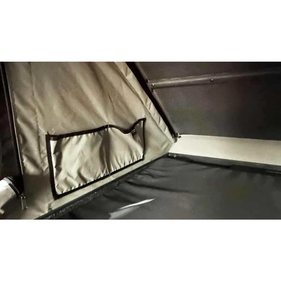 Close-up of a tent interior with a window and fabric details.