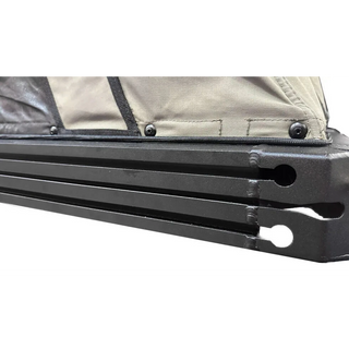 Close-up of a black metal bar with a beige fabric background – Bush Company LX27 Gen2 Lightweight Clamshell Rooftop Tent
