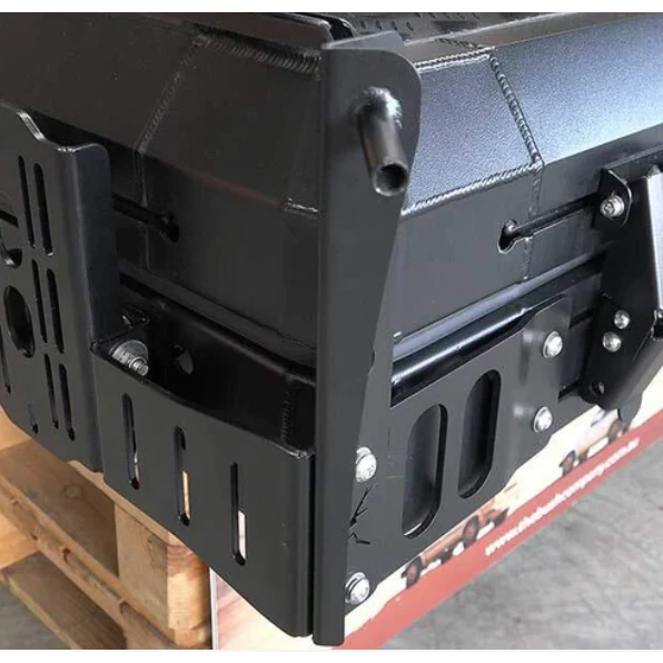 Close-up of the Bush Company Spring Rod Adapter bracket on a wooden pallet.