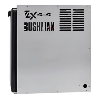 Side of a Bushman TX 4x4 fridge, the stainless panel carrying the Bushman name with the ventilation louvres and the condenser fins wrapping around the rear edge