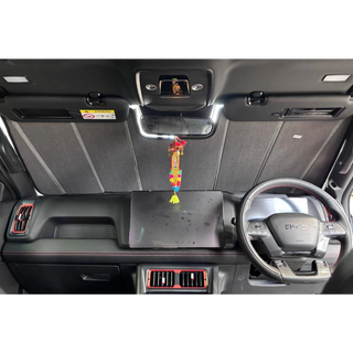 Sun shade fitted inside a BYD Shark, covering the full windscreen from the dashboard to the headlining with the mirror sitting clear