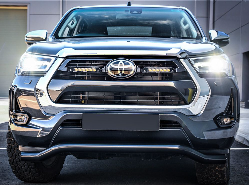 Front view of a Toyota truck with clear lighting
