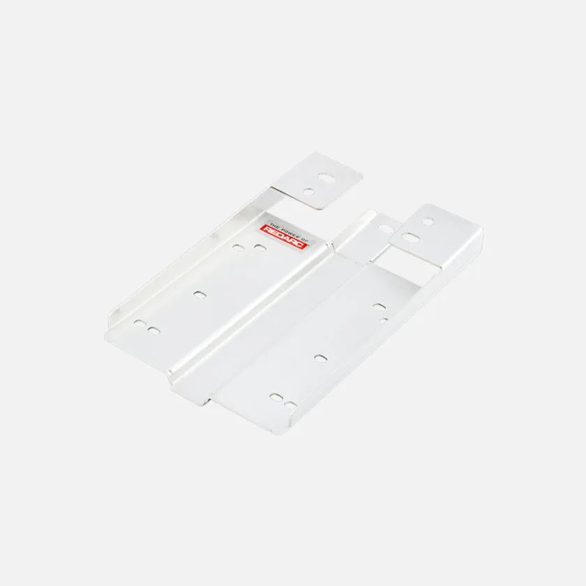 Two white Redarc mounting brackets shown together, a long flat plate with fixing holes along its length beside a matching plate with a raised mounting eye at one end