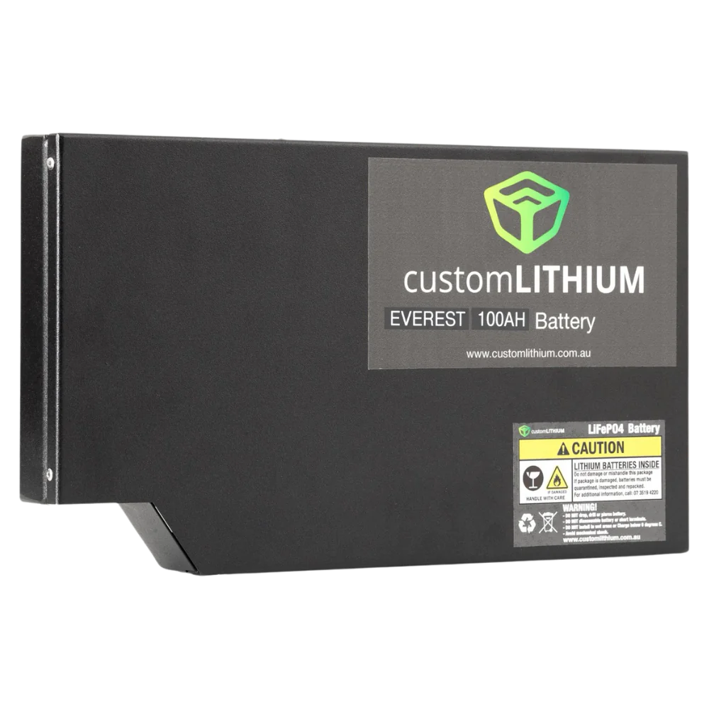 The Custom Lithium Everest 100Ah battery from the front corner, the moulded step in the base that clears the vehicle floor, the product label and the LiFePO4 caution label on the face