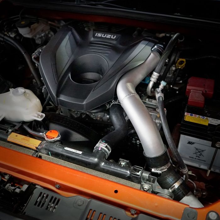 Car engine with Isuzu logo on a black background