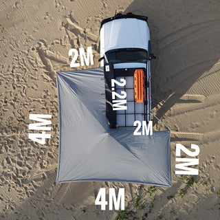 Measurement chart of a large gray tarp on sandy ground