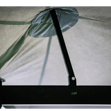 Close-up of a tent mesh with a pole and brand logo.