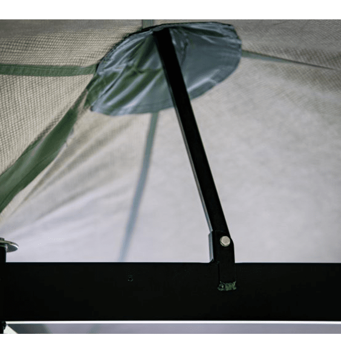 Close-up of a tent mesh with a pole and brand logo.