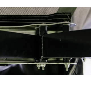 Close-up of a metal frame structure with bolts and straps.