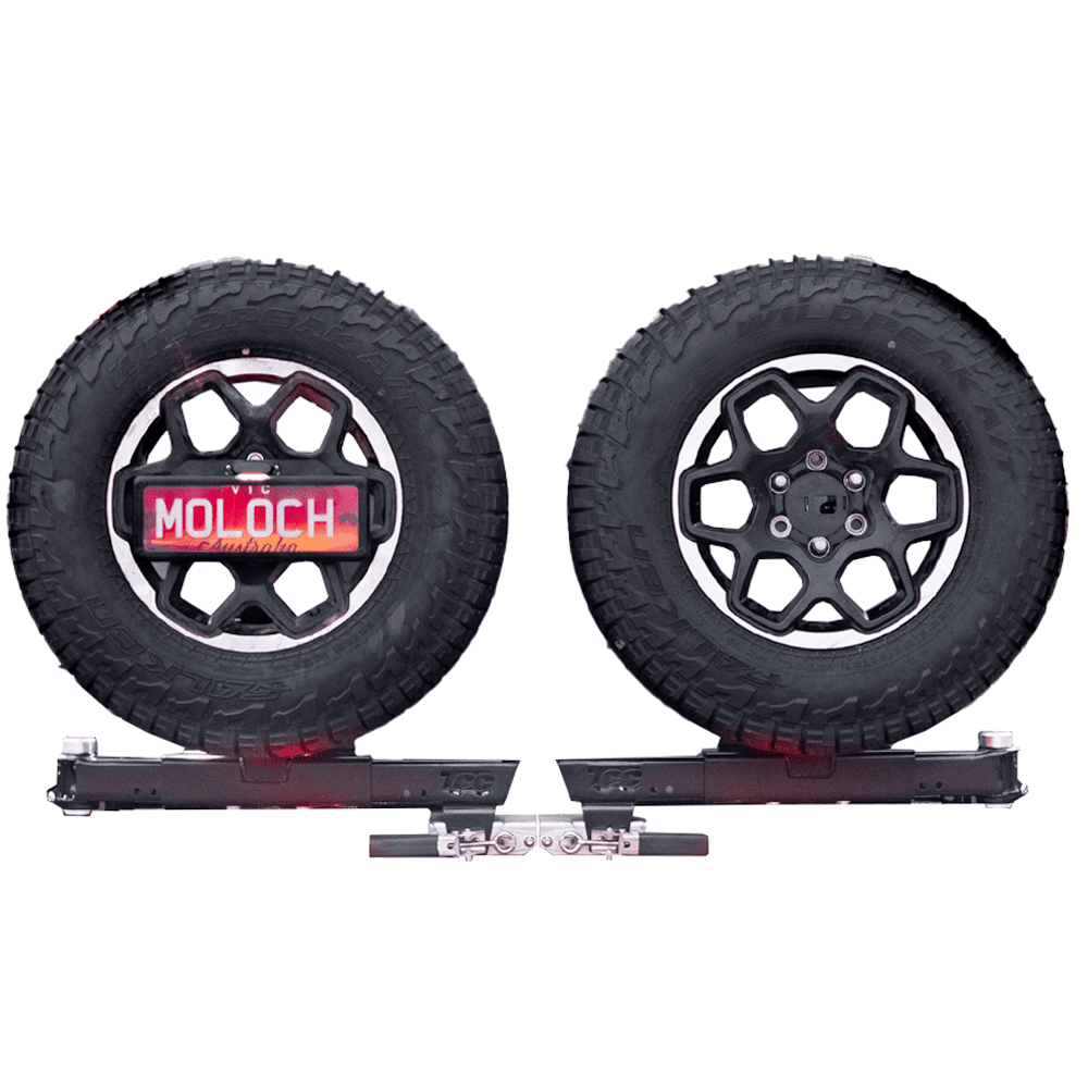 The rear bar shown on its own with both swing-away wheel carriers loaded with spare wheels, the carriers swung open to either side and the towbar tongue between them
