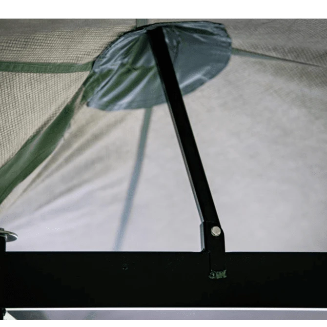 Close-up of a tent mesh with a pole and brand logo.