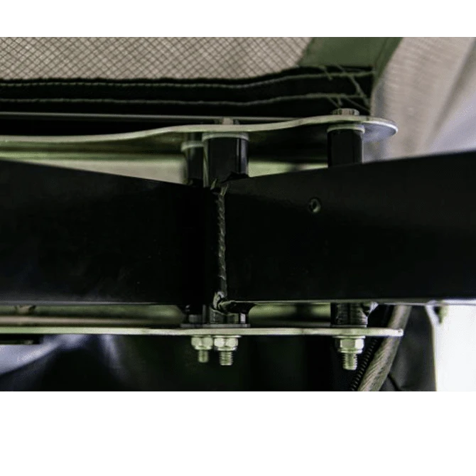 Close-up of a metal frame structure with bolts and straps.
